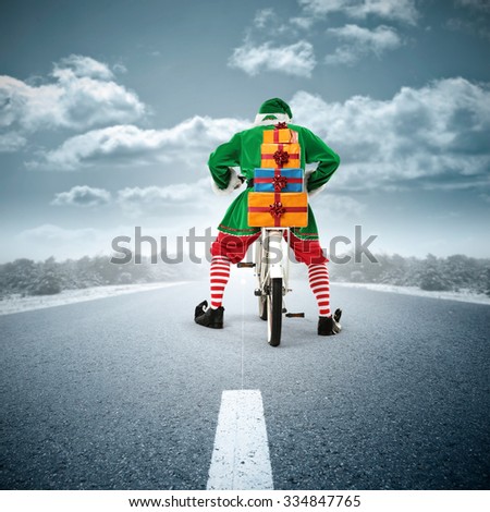 elf of green color and white bike and blue road and sky 
