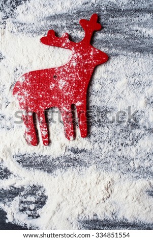 Christmas deers with flour spread on a cutting board