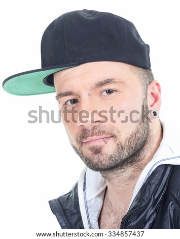 A Urban man wearing baseball cap over white background studio.