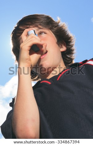 A picture of a boy who have an asthma crisis with sky on the background.
