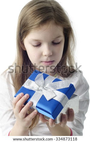 An image of young girl with gift