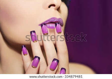 Lilac French manicure for a young woman with purple lips. Royalty-Free Stock Photo #334879481