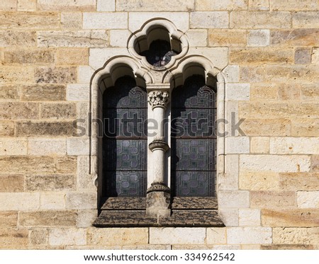 Stone window with stained glass in Germany church. Koenigstein Saxonian Switzerland Germany