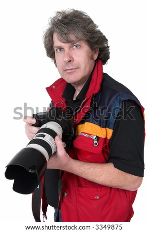 Photographer with digital SLR camera and long zoom lens wearing a red and blue sleeveless jacket, isolated on white.