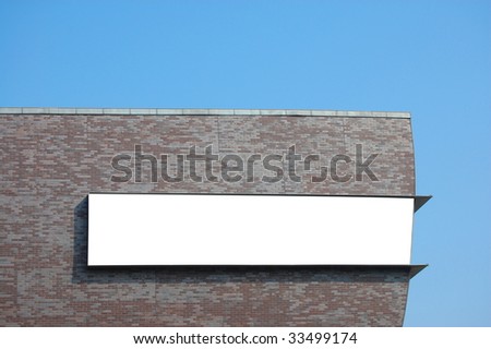 white empty billboard with copyspace for text and brickwall