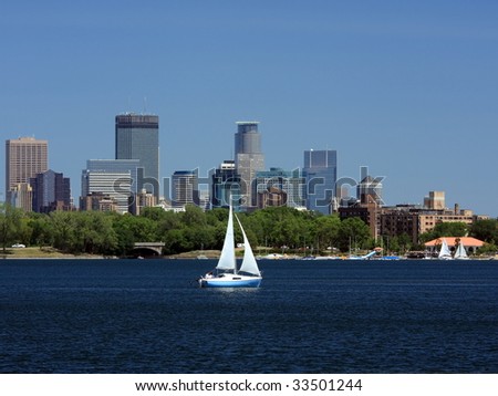 Sail boat and downtown Minneapolis at summer