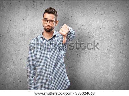 student man with thumb down