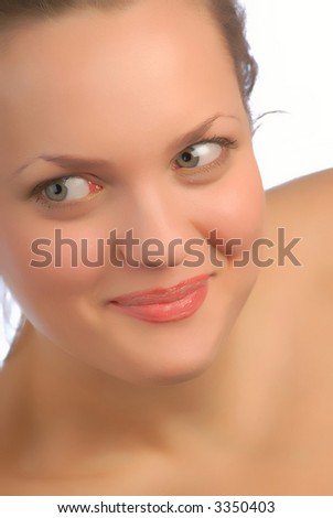 Nice Woman Looks Aside and Smiles on  White Background. Closeup.