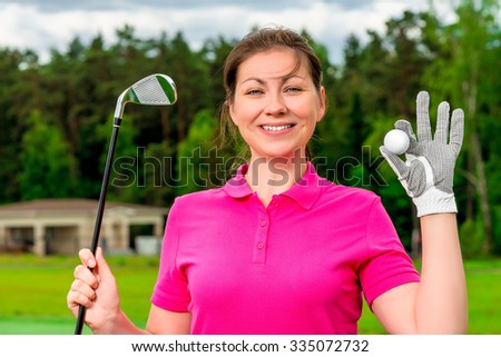 beautiful girl with a golf equipment smiling