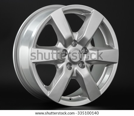 Aluminium metal wheel rim texture. Car alloy wheel, isolated on black background