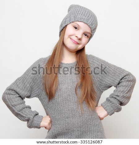 European fashion little girl wearing jeans and sweater