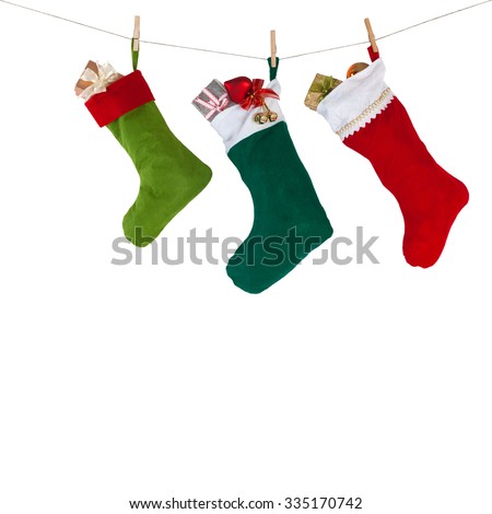 colorful xmas socks. red, green, dark green color. rope with clothespins. design decoration element, isolated