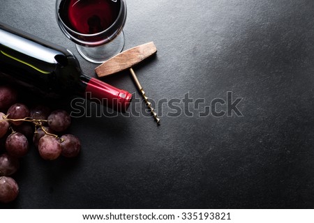 Red wine and grapes border background