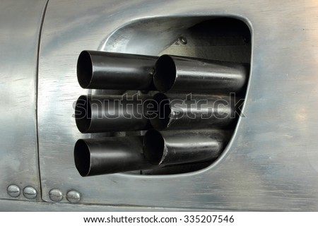 exhaust pipes of a old racing car Royalty-Free Stock Photo #335207546