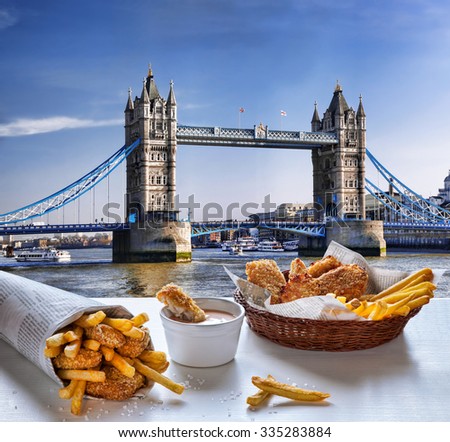 Fish and Chips against Tower Bridge in London, England Royalty-Free Stock Photo #335283884