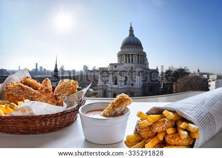 Fish and Chips against St. Pauls Cathedral in London. Royalty-Free Stock Photo #335291828