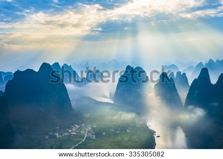 Landscape of Guilin, Li River and Karst mountains. Located near The Ancient Town of Xingping, Yangshuo County, Guangxi Province, China. Royalty-Free Stock Photo #335305082
