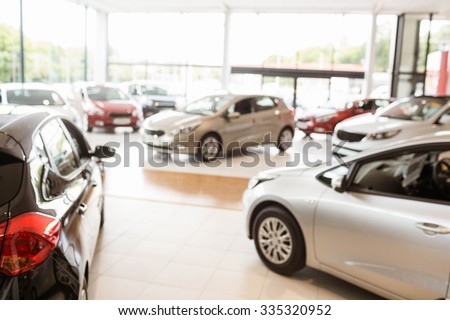 View of row new car at new car showroom Royalty-Free Stock Photo #335320952