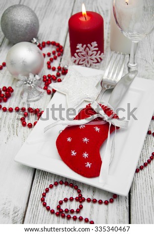 Christmas table setting with christmas decorations.