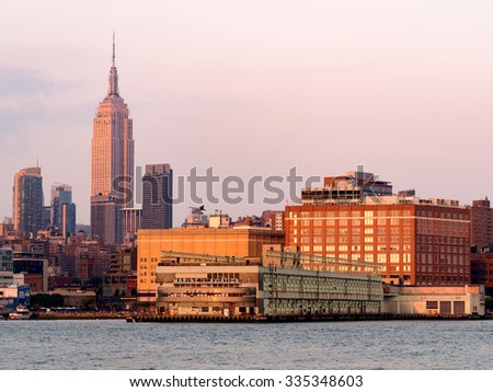 The skyline of New York City at sunset seen from the piers at the Hudson river