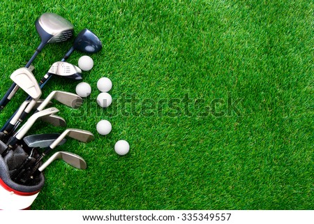 Golf ball and golf club in bag on green grass Royalty-Free Stock Photo #335349557