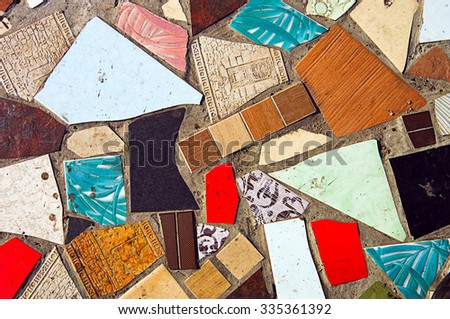 Old abstract texture colorful mosaic on the floor of broken ceramic tiles. Landscape style. Great background or texture.
