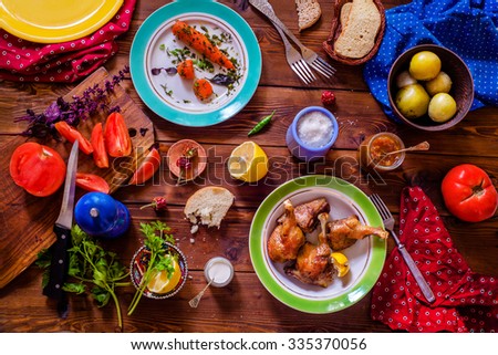 Top view of a Table setting with a variety of side dishes on a wooden table Royalty-Free Stock Photo #335370056