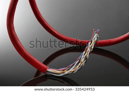 Cables,closeup of satellite and electric cable on a gray background