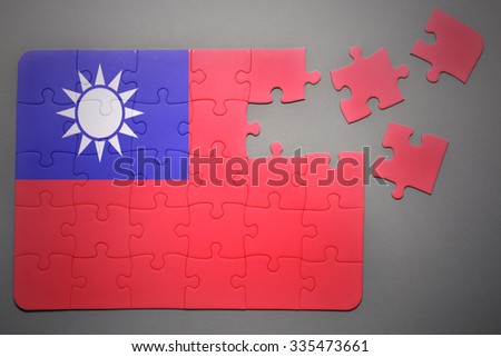 broken puzzle with the national flag of taiwan on a gray background