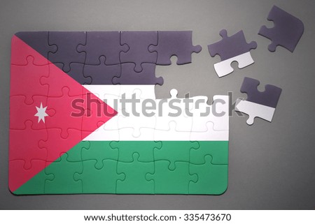 broken puzzle with the national flag of jordan on a gray background