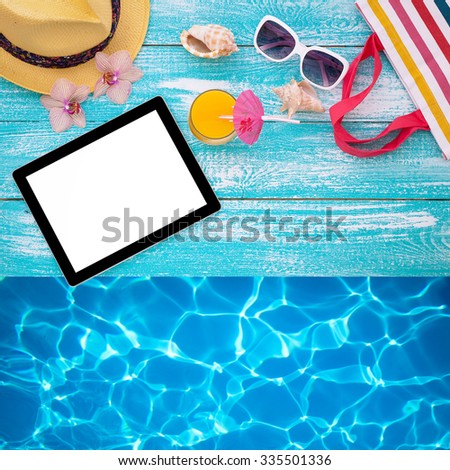 Tablet with clean screen on wooden table. Fashionable clothes sunglasses, hat, flip-flops for beach holiday. Orange juice, orchid flowers. Flat mock up for design. Top view.