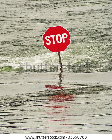 Stop sign in flooded river