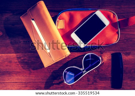 objects for travel isolated on a wooden background