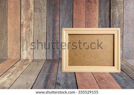 Photo frame on old wooden background