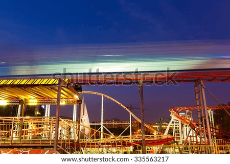 Evening picture carousel in an amusement park at autumn time