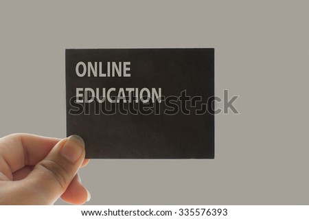ONLINE EDUCATION message on the card shown by a man, vintage ton