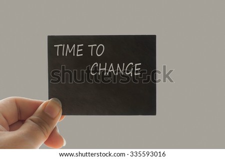 TIME TO CHANGE message on the card shown by a man, vintage tone