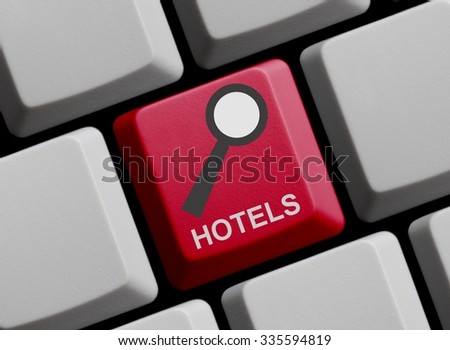 Red Computer Keyboard with symbol of magnifier with Hotels