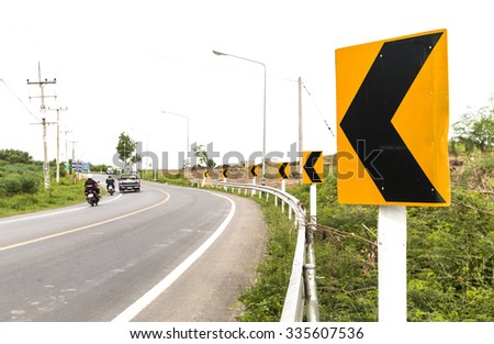 Traffic Signs on curve road 