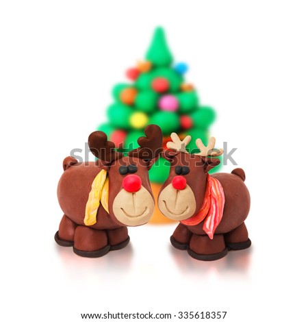 Couple of romantic christmas tree family cartoon plasticine deers on a white background