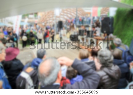 People crowd generic background. Intentionally blurred post production.