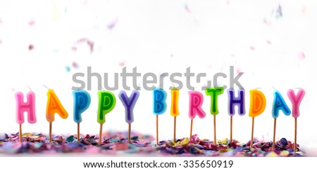Confetti and birthday candles isolated on white background, party concept