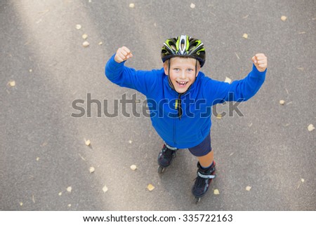 Happy boy excited about roller skating 