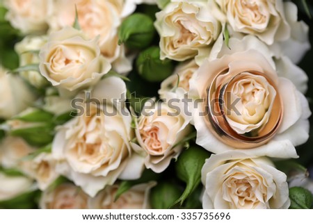 Closeup view of one beautiful fresh bright white yellow big wedding bouquet of rose flowers, horizontal picture