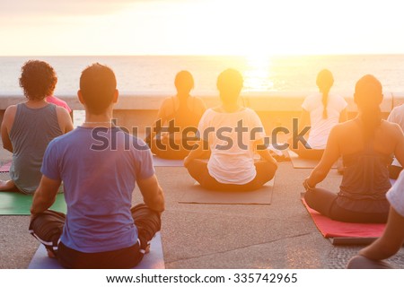 sunset yoga Royalty-Free Stock Photo #335742965