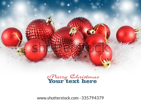 Christmas background with red bauble,snow and snowflakes