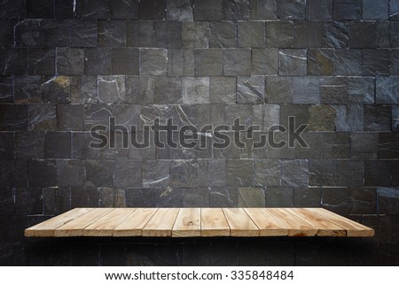 Empty top wooden shelves and stone wall background. For product display 