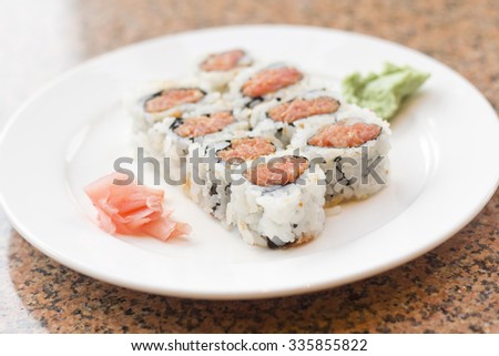 Spicy tuna roll Toro Maki sushi roll with wasabi sauce and pickled ginger