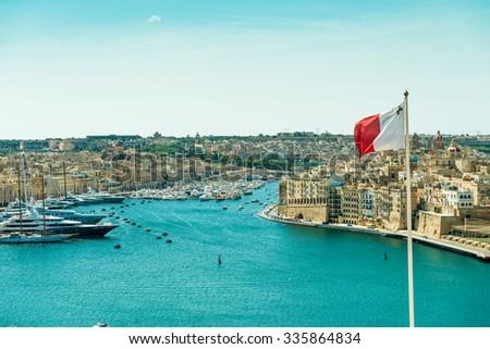 panoramic view on Valletta  with the flag of Malta in the foreground Royalty-Free Stock Photo #335864834