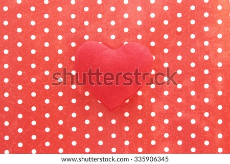 Red heart on polka dot background